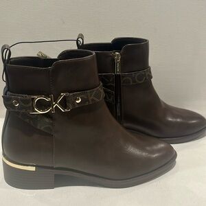 Calvin Klein Brown Ankle High Boots with Goldtone Hardware around Heel & Ankle.